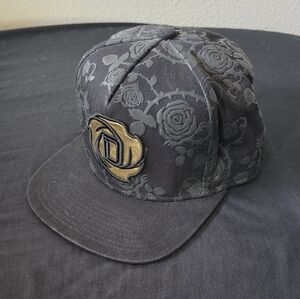 New Era Black Floral Snapback with Gold Emblem